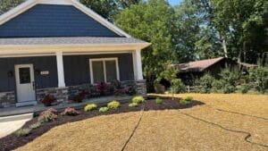 Finished landscaping and lawn installation around new construction home