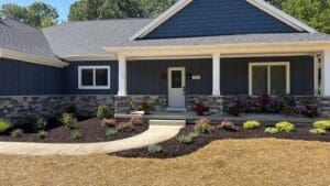 New home with completed lawn installation and professional landscaping in Fort Wayne