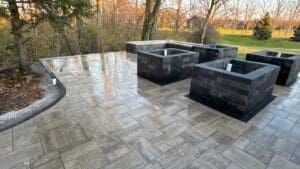 Finished custom hardscape patio installation with landscaping in Fort Wayne