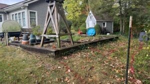 Existing backyard lawn and patio space before hardscape construction in Fort Wayne Indiana