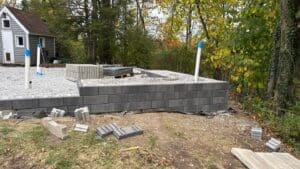 Excavation and grading work during patio installation project in Fort Wayne